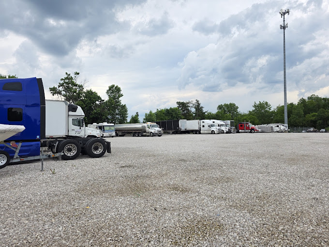 SH OH Truck Repair parking lot with commercial trucks and equipment